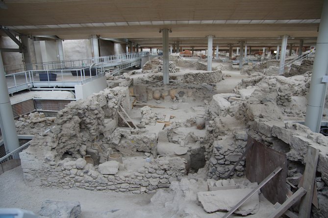 Archaeological Bus Tour To Akrotiri Excavations & Red Beach - Perissa or Perivolos finishes with sand and swimming