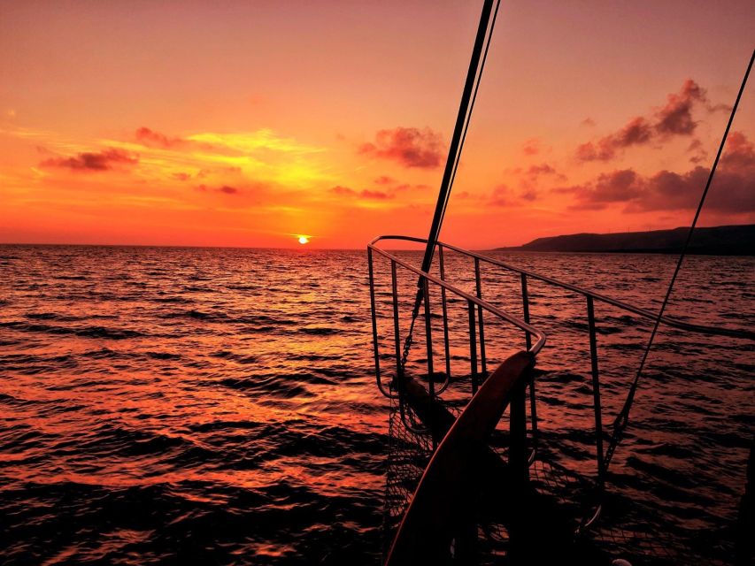 Argostoli: Sunset Cruise with Swim Stops, Dinner, and Wine - Xi Beach, red sand, and the weather backup