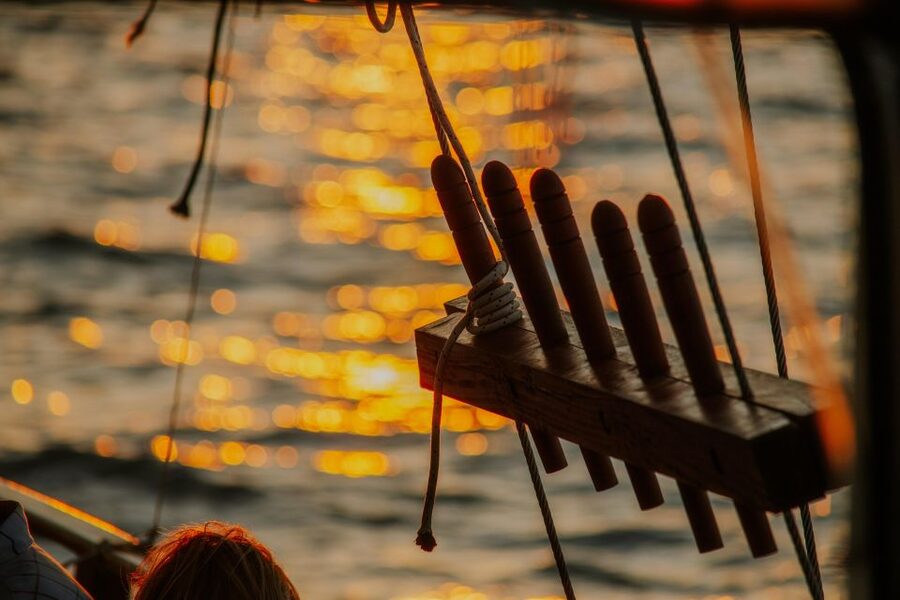 Argostoli: Sunset Cruise with Swim Stops, Dinner, and Wine - Dinner on deck as the sun drops