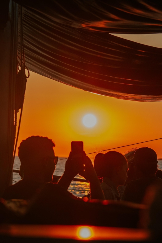 Argostoli: Sunset Cruise with Swim Stops, Dinner, and Wine - Sailing toward the Vardiani Islands