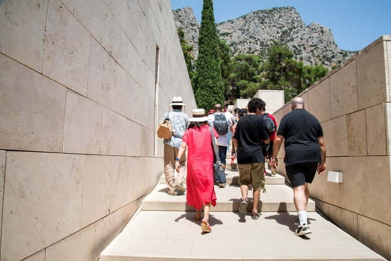 Athens: Delphi and Arachova Day Trip with Guide - Walking through the Delphi archaeological site
