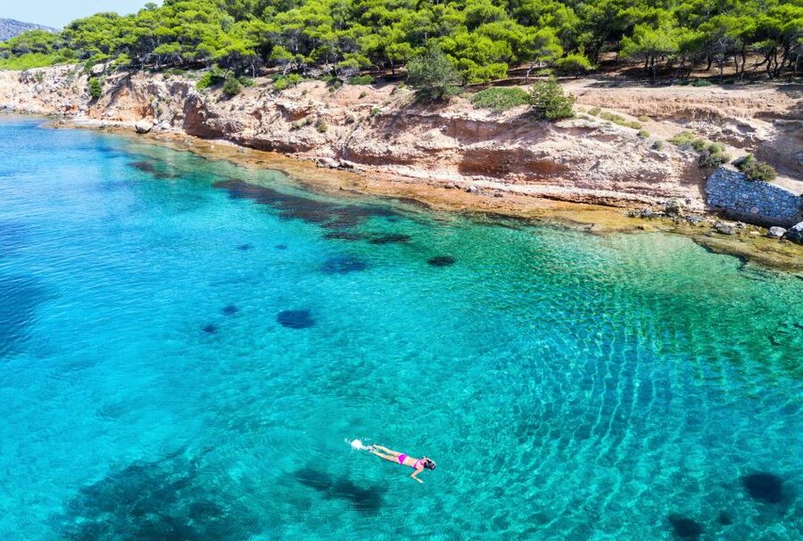 Athens: Full-Day Island Hopping Cruise with Lunch & Transfer - Settling into the traditional wooden boat