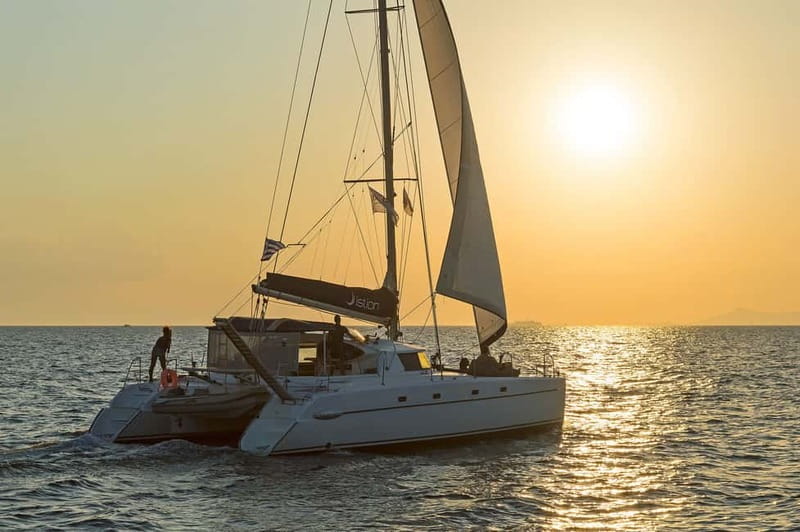 Athens: Half-Day Sunset Catamaran Cruise with Meal & Drinks - Leaving Athens for the Saronic Gulf