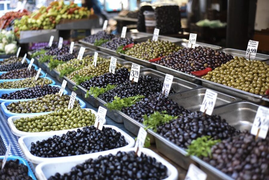 Athens: Ultimate Food Walking Tour with 15 Tastings - Cured meats, wine, olives, and local shop owners