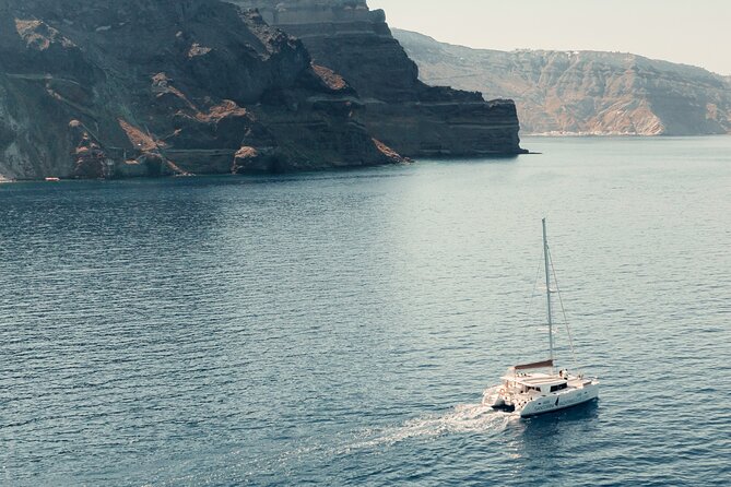 Beautiful Day Catamaran Caldera Cruise incl. Meal & Drinks - Mesa Pigadia and White Beach with lunch on the grill