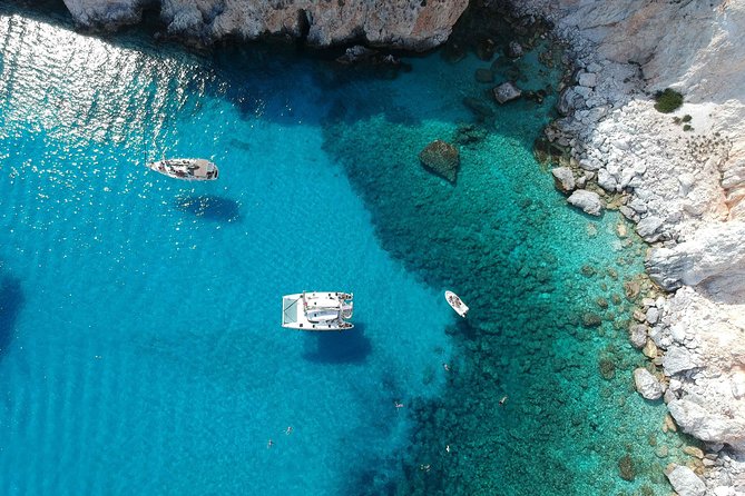 Best of Milos and Poliegos Catamaran snorkelling Cruise with BBQ - Gerakas Beach and its pale perlite slopes