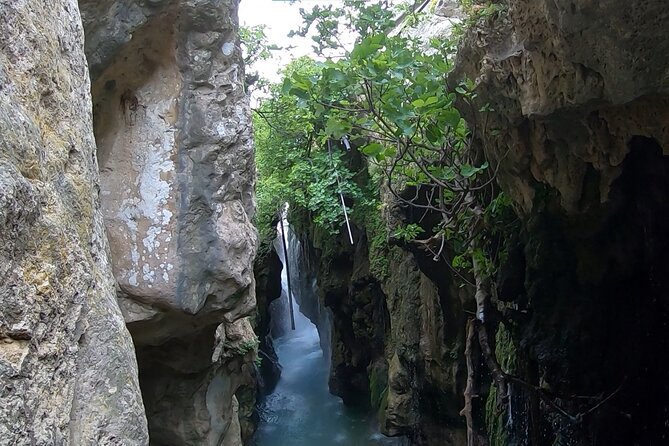 Canyoning in the water - Kourtaliotiko Gorge - Walking through the river to the Fairy Cave