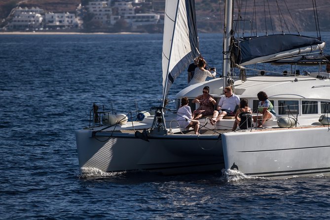 Catamaran Day & Sunset Cruises with meals Drinks and transportation - Sunset sailing back toward Mykonos