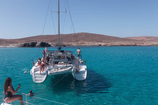 Catamaran Day & Sunset Cruises with meals Drinks and transportation - Boarding at Tourlos and settling onto the catamaran