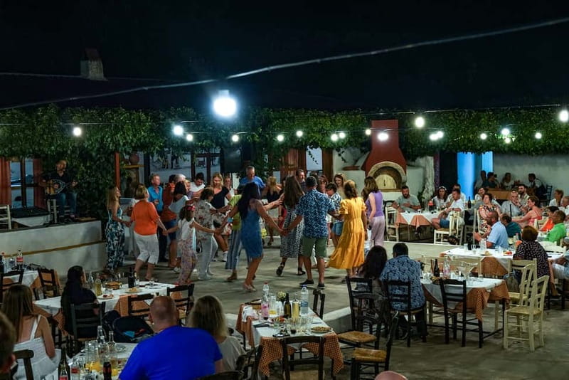 Cretan Night: Dinner & Live Show at Pano Karouzanos Village - Dinner, local wine, and a family-run setting