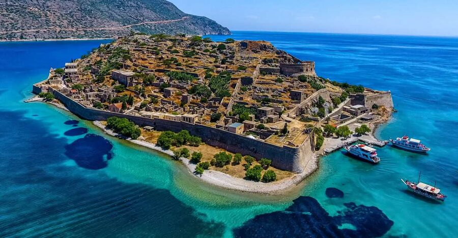 Crete: Spinalonga, Elounda, & Agios Nikolaos Boat Tour & BBQ - Elounda and the boat across Mirabello Bay