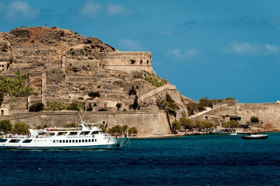 Crete: Spinalonga, Elounda, & Agios Nikolaos Boat Tour & BBQ - Spinalonga and its layered past