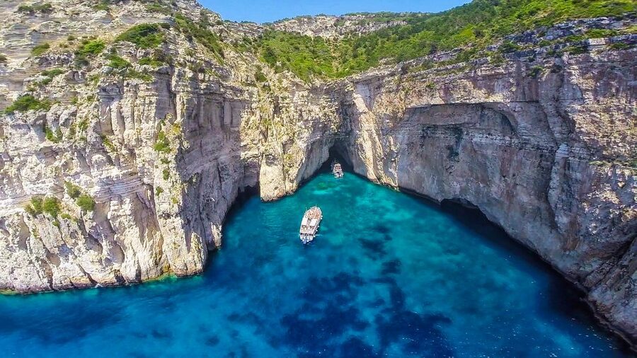 From Corfu: Day Cruise to Paxos, Antipaxos, and Blue Caves - Entering the Blue Caves along Paxos