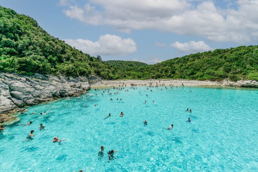 From Corfu Island: Antipaxos & Paxos Blue Caves Boat Cruise - The Blue Caves and the white cliffs of Erimitis