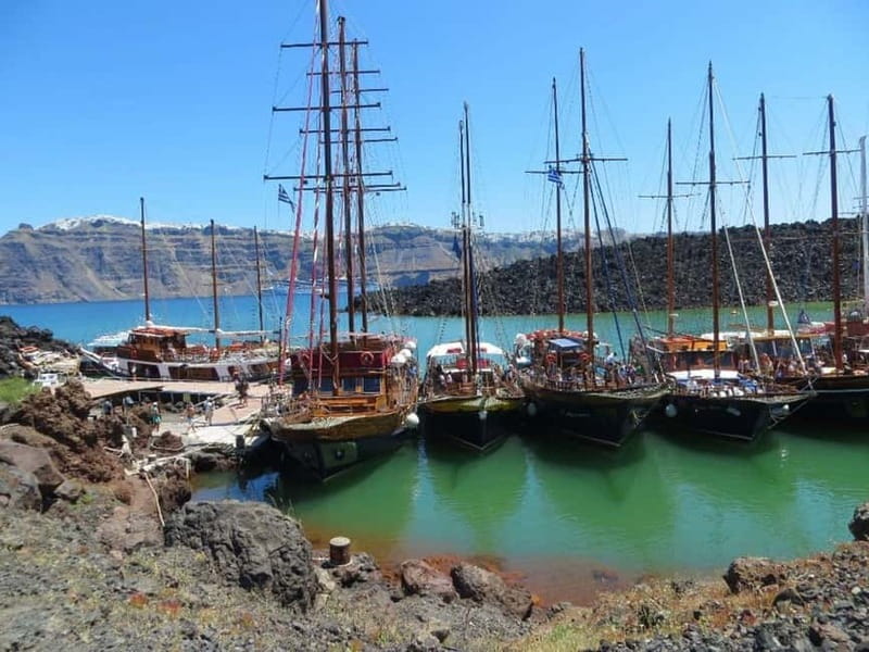 From Santorini: Volcano Cruise With Oia Sunset - Boat comfort, guides, and the long return