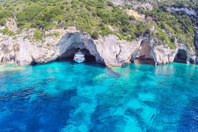 Full-Day Boat Tour of Paxos Antipaxos Blue Caves from Corfu - Paxos cliffs, white beaches, and the Blue Caves