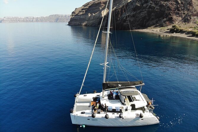 Half-Day Exclusive Catamaran Cruise in Santorini with Meal and Open Bar - Red Beach, White Beach, and Mesa Pigadia