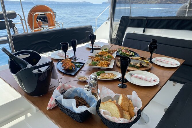 Half Day Premium Catamaran Cruise in Santorini including Oia - Limestone formations and clear water