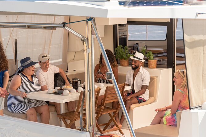 Hersonissos: Luxury Sunset Catamaran Cruise Sushi & Open Bar - Setting sail from Hersonissos toward Saint George Bay