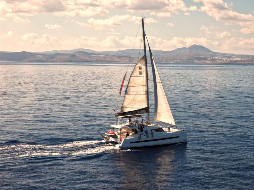 Hersonissos: Sunset Catamaran Cruise with Snacks and Drinks - The first hour along Crete’s coast