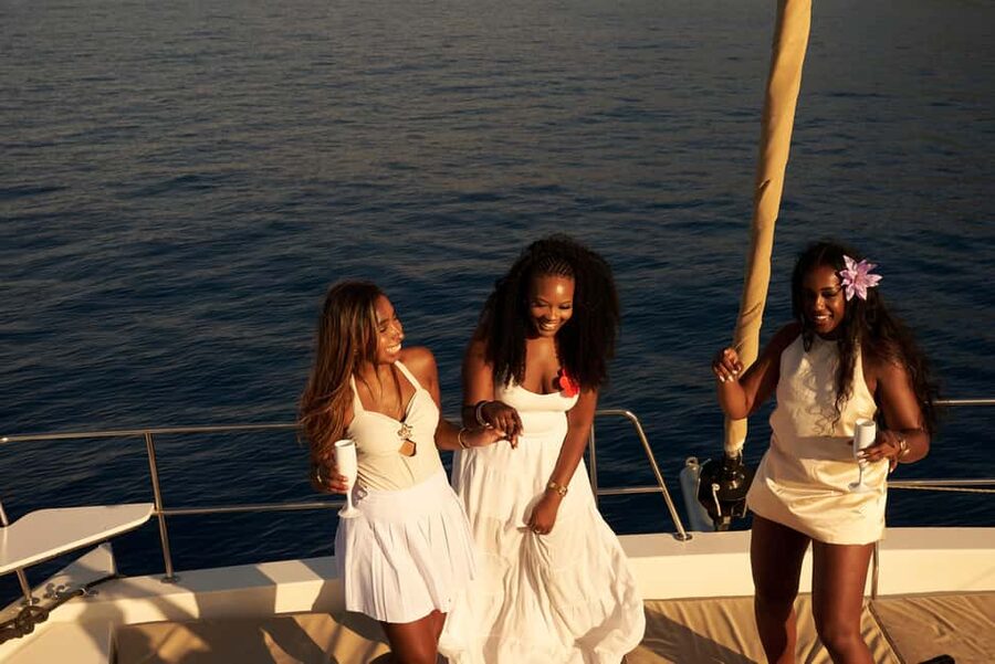 Hersonissos: Sunset Catamaran Cruise with Snacks and Drinks - Agios Georgios Bay and the water stop