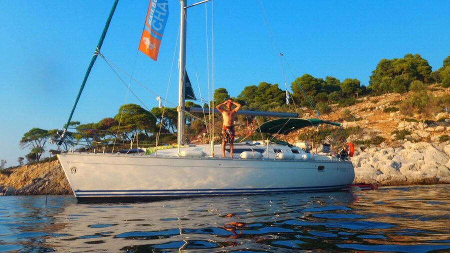 Kassandra: Sunset Sailing Boat Tour of Secluded Coves - The swimming stop and clear Aegean water