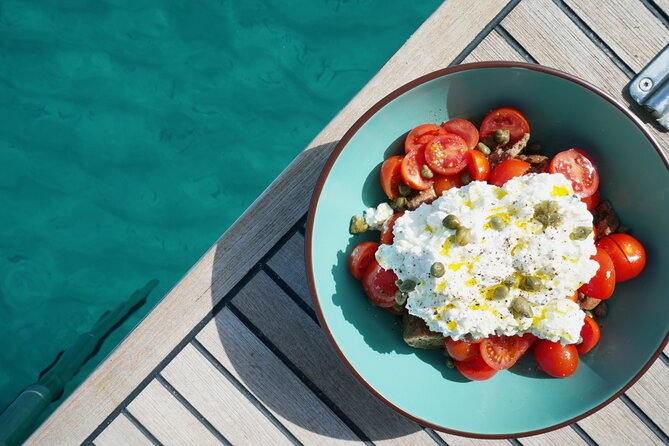 Luxury Catamaran Sunset Semi-Private & Greek Gastronomy in Athens - Vouliagmeni Beach is a weather-dependent bonus