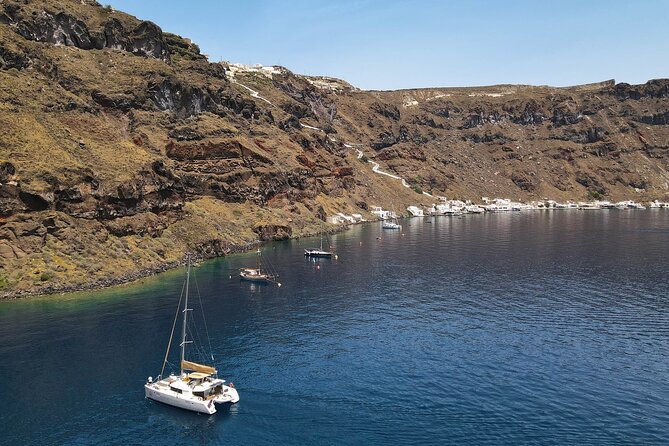 Luxury Santorini Sunset Cruise: Dinner, BBQ, Open Bar, Transfers - Red Beach, White Beach, and the Akrotiri Coast