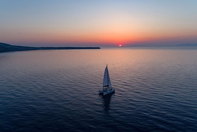 Luxury Sunset Cruise with Swim Stops, BBQ meals and Open Bar - Five hours around Santorini’s volcanic caldera