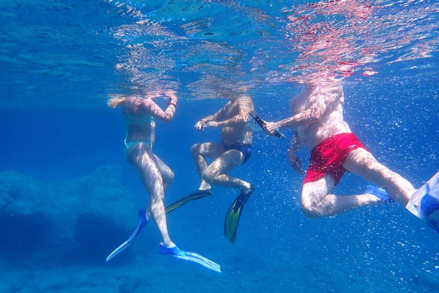 Milos: Guided Kayaking Trip with Snorkelling & Lunch - The first beach stop, swimming, snorkeling, and snacks