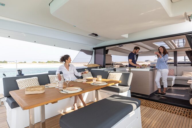 Mykonos: Brand-New Catamaran Cruise with Meal, Drinks & Transport - Lunch, drinks, and the value of the fare