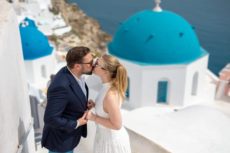 Oia: Couple photoshoot with 30 edited Photos - The blue domes, caldera, and whitewashed lanes