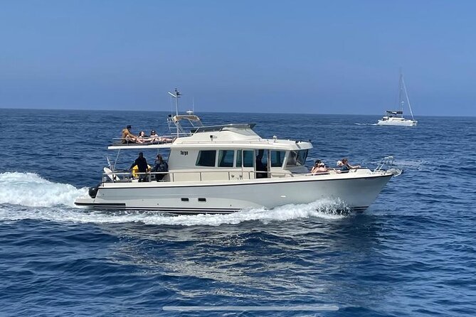 Private Full-Day Motor Yacht Cruise with Meal, Open Bar+Transfers - Akrotiri Lighthouse and the passage into the caldera