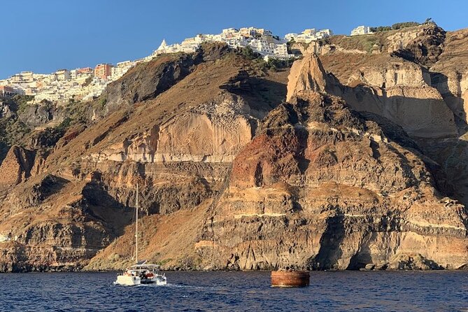 Private Luxury Santorini Catamaran Cruise with Port Pickup - Lunch or dinner beside the volcanic islands