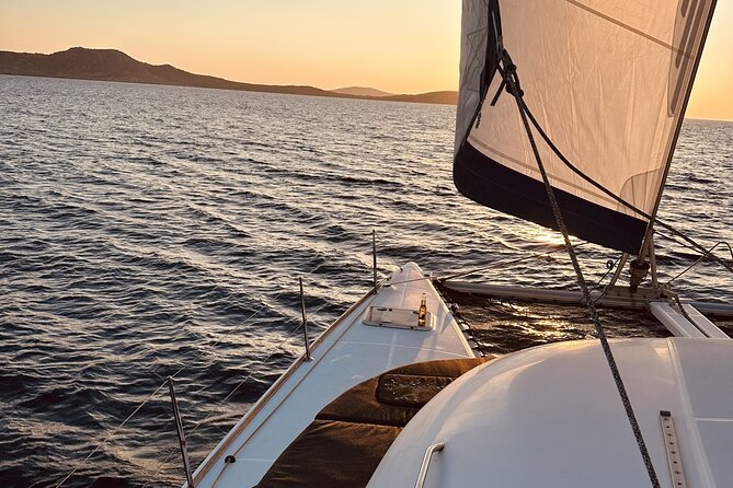 Private Mykonos Catamaran Day Cruise with Meals & Water Toys - Stop two: Delos, ancient stone in open water