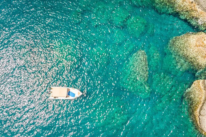 Rent a Boat in Santorini with Free License - Taking the helm from Vlichada