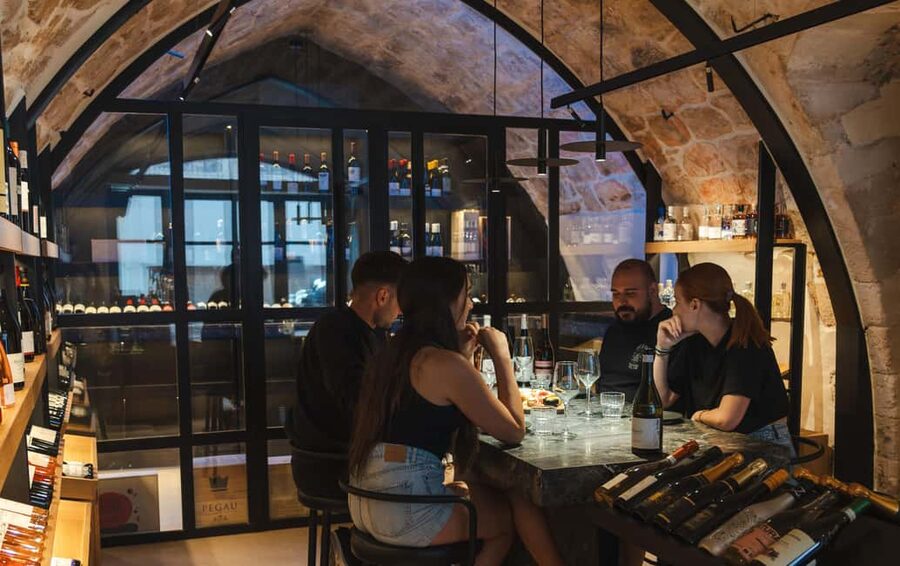 Rethymno: Cretan Wine Tasting Guided Tour with Local Food - Sella Vineria and the old-town setting