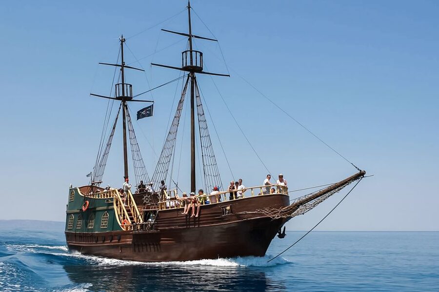 Rethymno: Sunset Cruise on a Wooden Pirate Boat - Sunset beyond the harbor