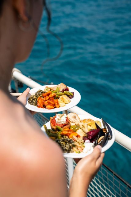 Rhodes: Bay to Bay Swim Cruise with Greek Buffet and Wine - Greek lunch, local wine, and the onboard bar