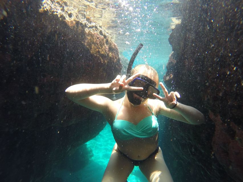 Rhodes: Beach Cruise with Swimming, Meal, & Unlimited Drinks - Racing past Rhodes Old Town and Faliraki