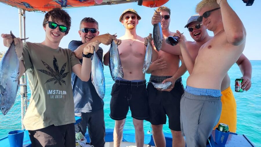 Rhodes: Fishing Trip, Snorkelling, BBQ, & Professional Guide - Leaving Rhodes Town aboard a working wooden boat