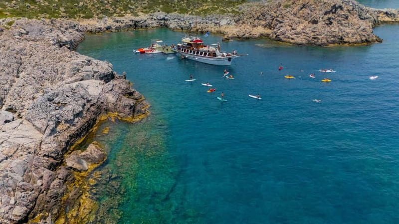 Rhodes: Gulet Trip with Food, Drinks, SUP, Kayak & Swimming - Greek lunch, fruit, and drinks on deck