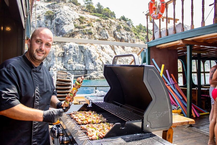 Rhodes: Sunset Cruise with Greek BBQ and Unlimited Drinks - Greek BBQ, Music, and the Return Sail