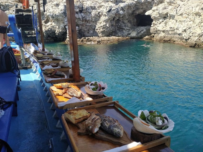 Rhodes Town: Fishing Boat Trip with Fish Meal and Swim Stops - A quiet cove for swimming and snorkeling