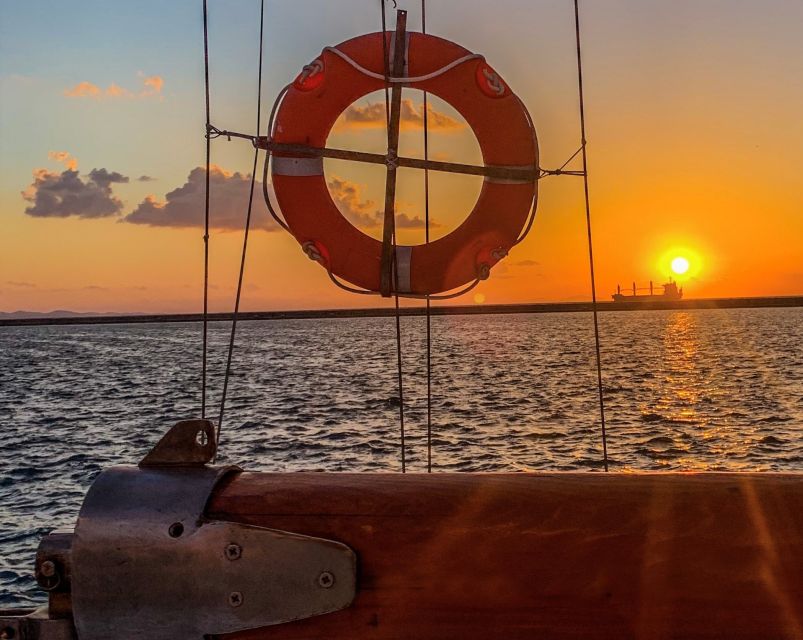 Rhodes Town: Sunset Boat Cruise with Drinks & Snacks - Booking, cancellation, and access