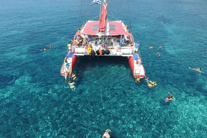 Sailing Catamaran Cruise in Santorini with BBQ, Drinks and Transfer - White Beach, swimming, and lunch