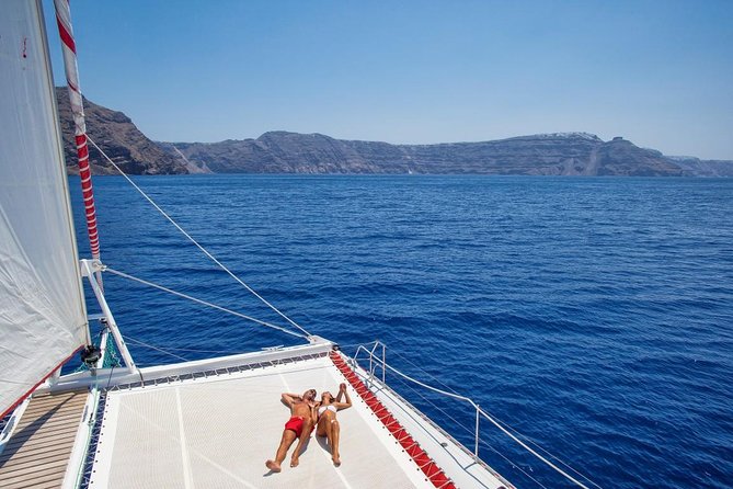 Sailing Catamaran Cruise in Santorini with BBQ, Drinks and Transfer - Timing, weather, and comfort tips