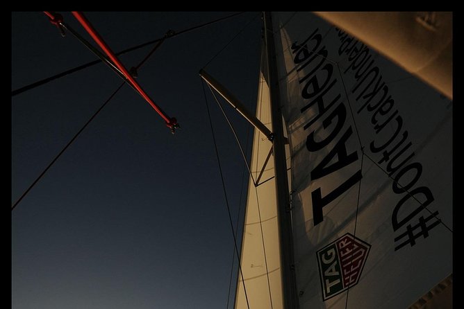 Santorini Adventurous Catamaran Experience with Snorkeling - The Akrotiri lighthouse and southern coast views