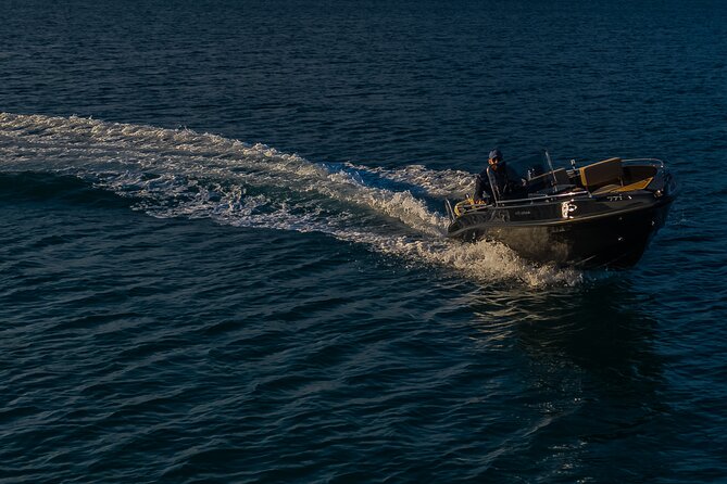 Santorini Boat Rental: License Free and Full or Half Day Options - Taking the helm from Vlychada Marina