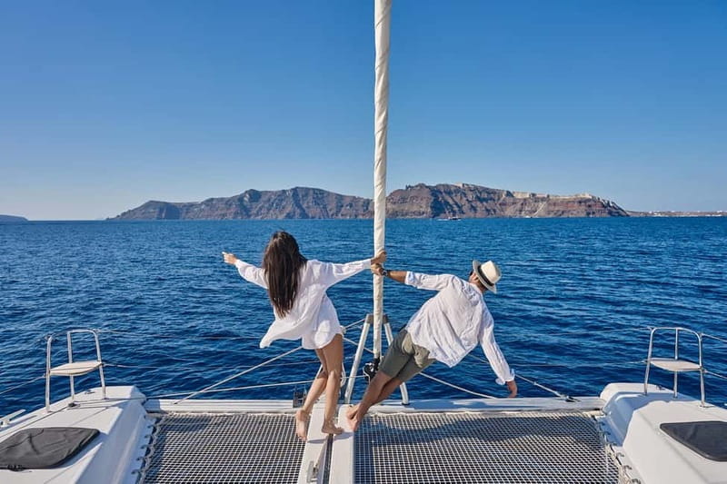 Santorini: Caldera Classic Catamaran Cruise w/ Meal & Drinks - Red Beach and the scarlet cliffs